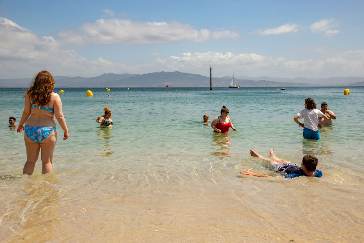Image of people enjoying a swim in the sea